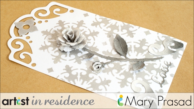 Shimmery tag made with Delicata Inks featuring a three dimensional Rose made by Mary Prasad.