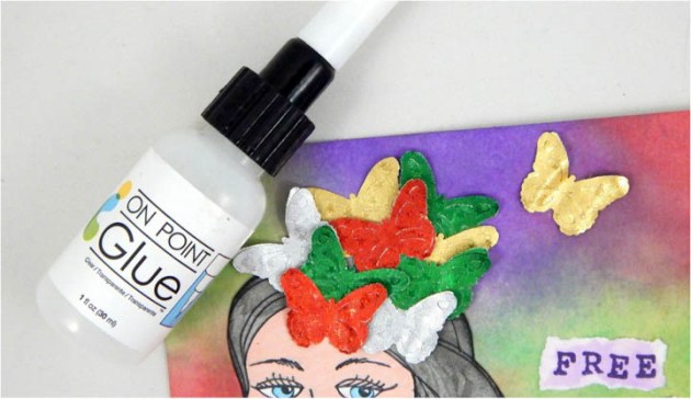 Adhere the girl image onto the card with On Point Glue. On Point Glue is perfect for these small pieces