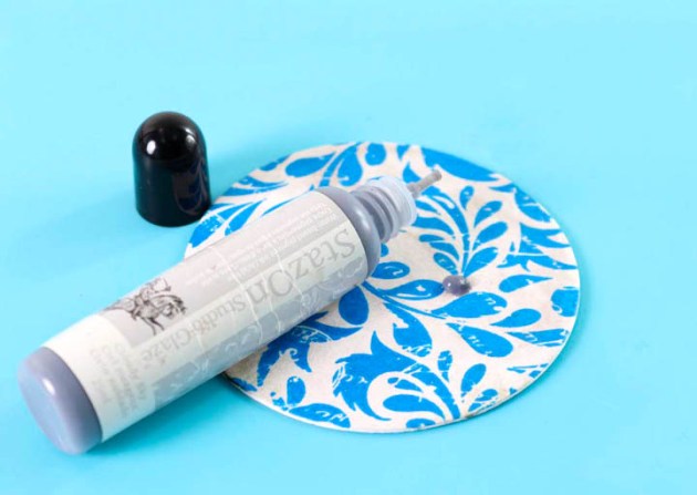 Add a few drops of StazOn Studio Glaze Cloudy Sky onto the embossed background