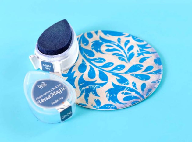 Ink the edges of the embossed disk using VersaMagic Night Sky