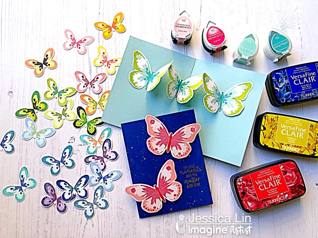 Handmade cards featuring colorful butterflies stamped in multiple layers with Tsukineko inks.
