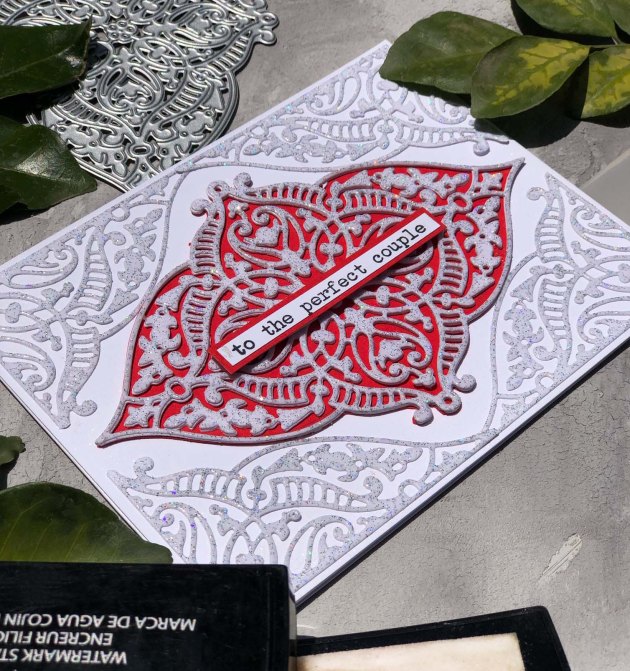 Learn How To Make An Intricate Wedding Congratulations Card using Mboss embossing powder and a metal diecut 